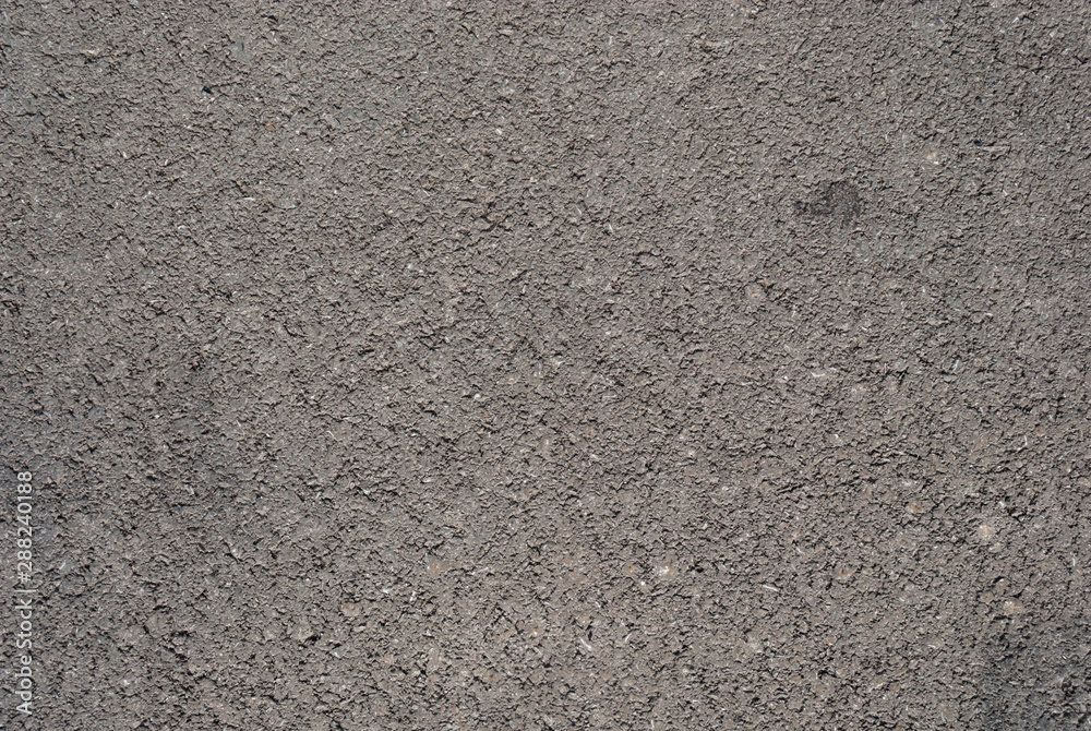 Smooth asphalt road. Tarmac dark grey grainy road background. Top view grunge rough surface Smooth asphalt road. Tarmac dark grey grainy road background. Top view grunge rough surface