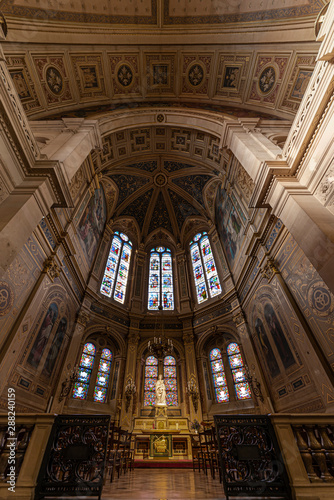 Inner view of the Saint Trinity church in Paris, illuminated by the early autumn light through the tainted glasses
