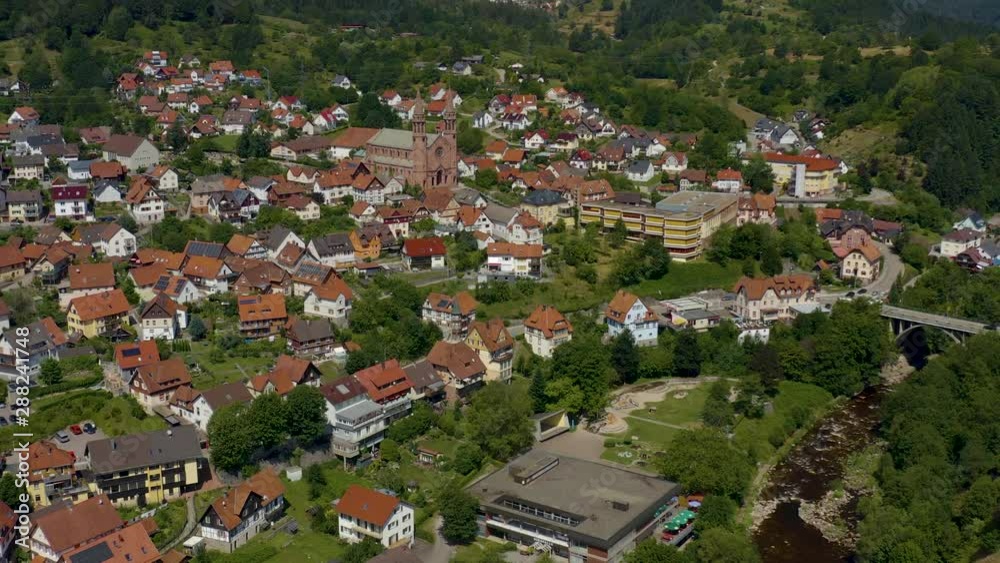 Aerial view of the city Forbach in Germany, on a sunny day in summer. Zoom out and ascent from the city. Aerial view of the city Forbach in Germany, on a sunny day in summer. Zoom out and ascent from the city.
