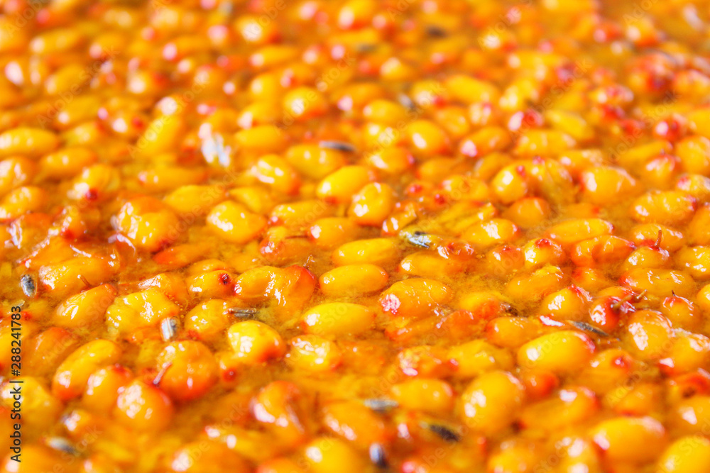 Fresh sea buckthorn jam. Close-up. Background. Texture.