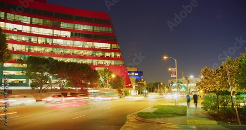Night time-lapse of traffic during rush hour at Pacific Design Center in West Hollywood, Los Angeles
