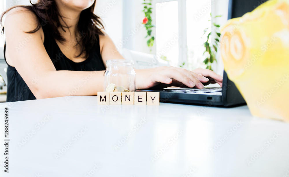Fototapeta premium the future of Finance, business banking and financial concept. Housewife sitting at the table and leads the calculation of Finance, Economics