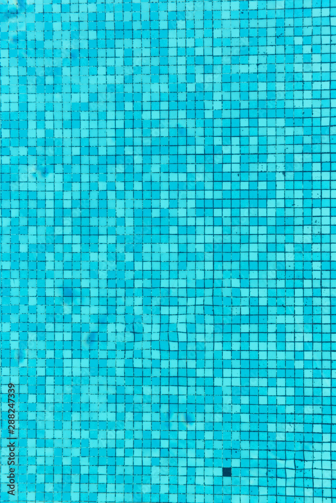 Blue tiles on the bottom of the pool under the water. Blue tiles on the bottom of the pool under the water.