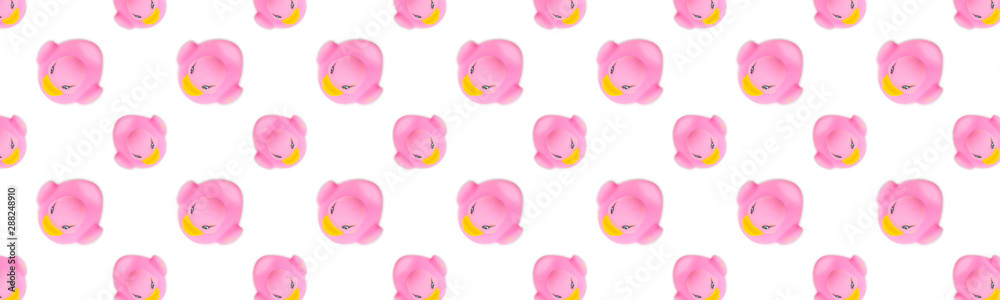 Pink background. Rubber plastic toy for bathroom. Seamless background.
