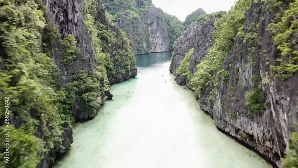 Aerial flight over the beautiful rivers between the mountains on a sunny day on the philippines. 4K Drone Shot. Aerial flight over the beautiful rivers between the mountains on a sunny day on the philippines. 4K Drone Shot.