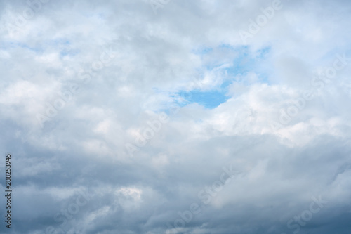  Cloudy sky with a part of clear blue sky. Natural background. 