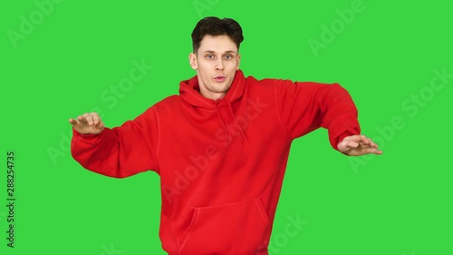 Breakdancer Freestyle Electric Boogie Dance on a Green Screen, Chroma Key. photo