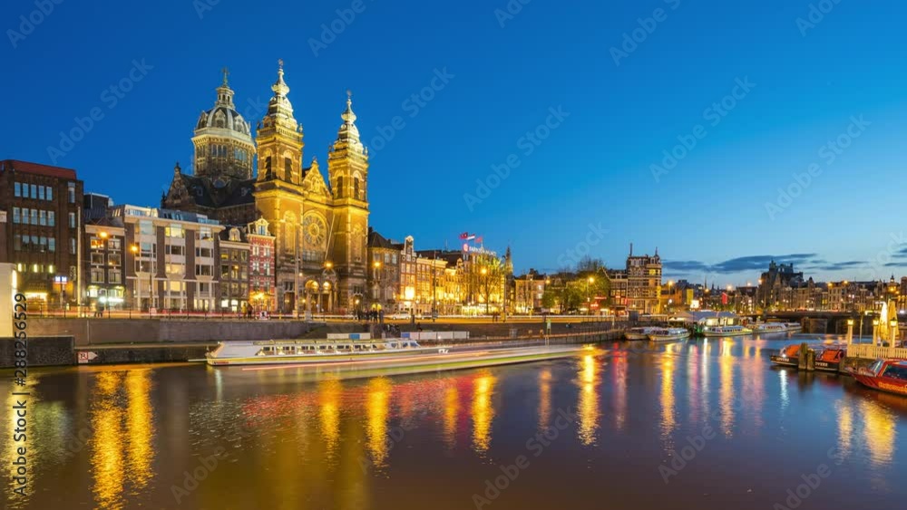 Amsterdam Saint Nicholas Church with city skyline time lapse in Amsterdam city, Netherlands. Amsterdam Saint Nicholas Church with city skyline time lapse in Amsterdam city, Netherlands.