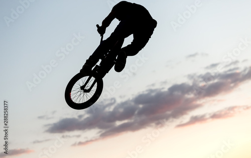 BMX cyclist training in a late afternoon