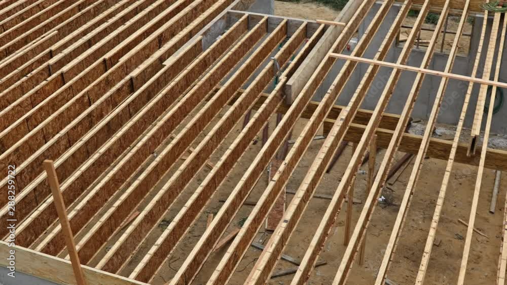 Engineered wood floor joist on a new custom house framing floor joists Engineered wood floor joist on a new custom house framing floor joists