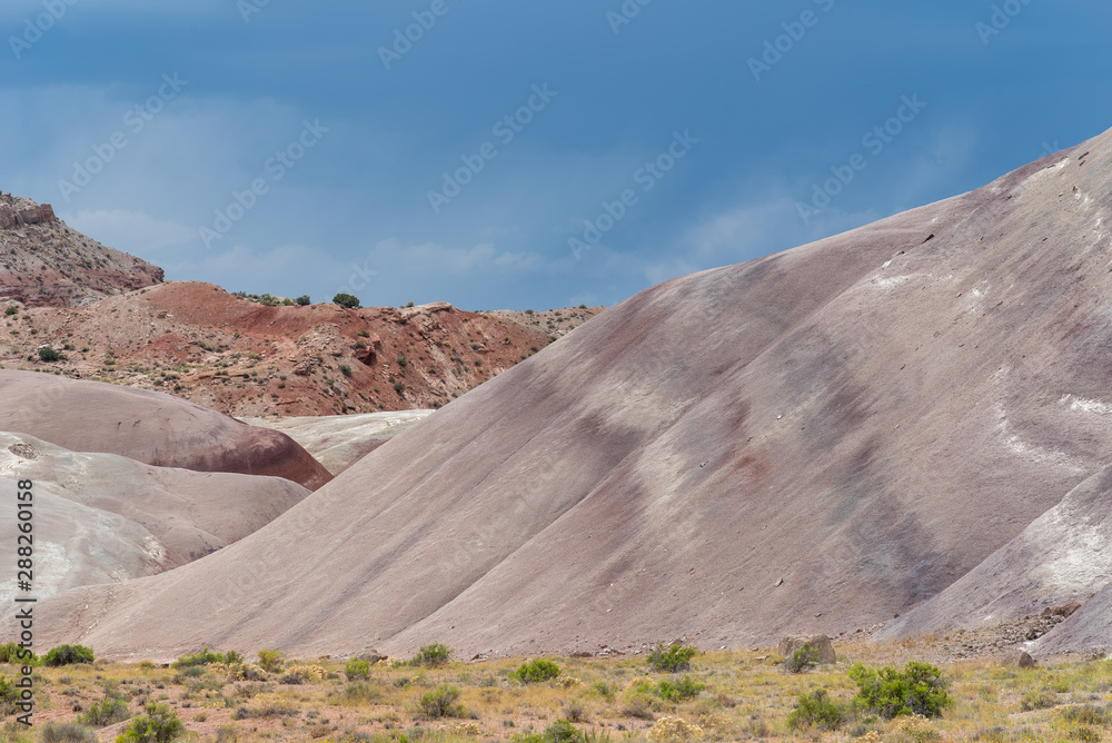 Landscape of barren striped grey hillside near Hanksville, Utah