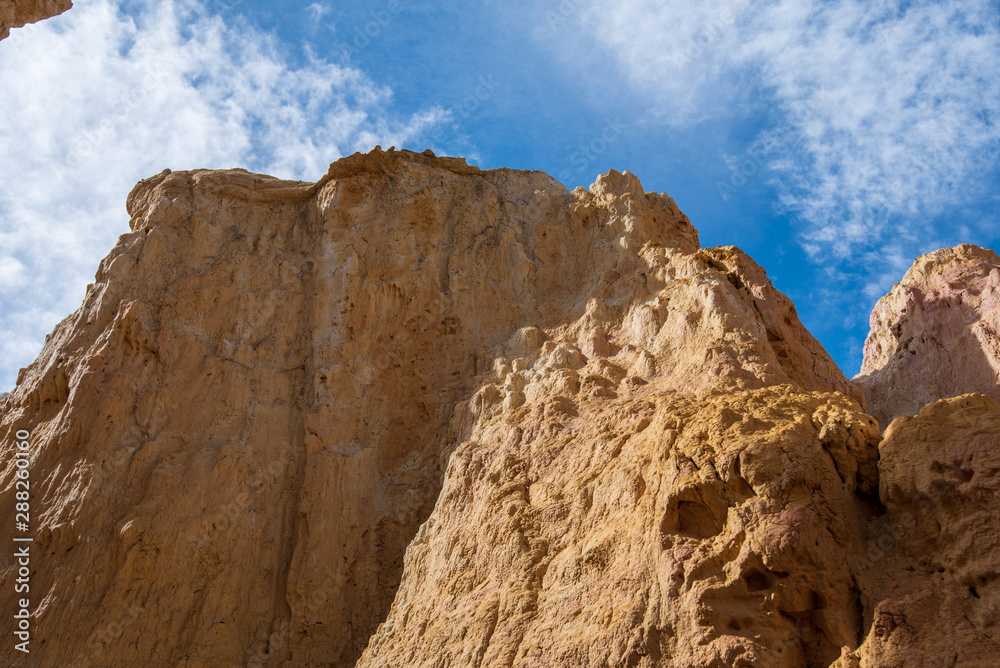 Fototapeta premium Low angle landscape of bare yellow stone formation at Interpretive Paint Mines in Colorado