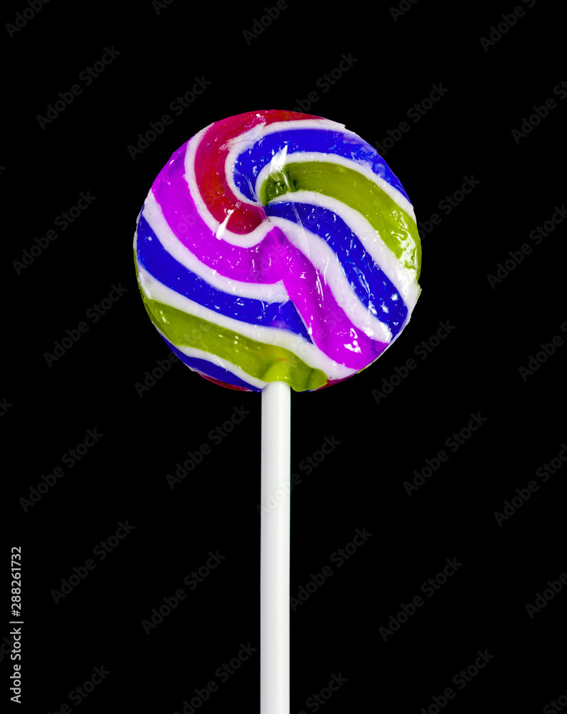 Stick to sweets. Cream jelly soft rainbow. Separately on a black background. Stick to sweets. Cream jelly soft rainbow. Separately on a black background.