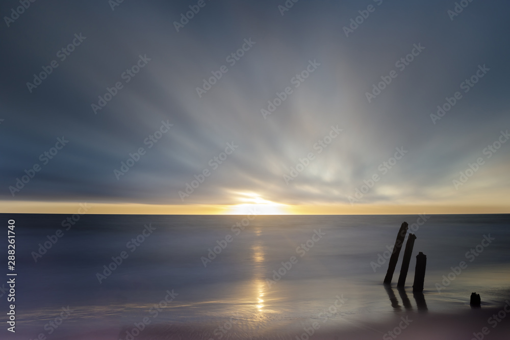 Sun peeking thru moving foggy clouds. Fort Funston, San Francisco, California, USA.