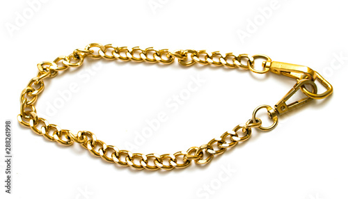 Gold chain of large cross section on a white background.