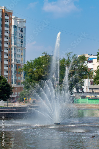 City fountain, nature landscape summer day.