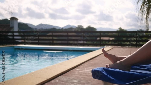 girl plays in her large villa near the pool