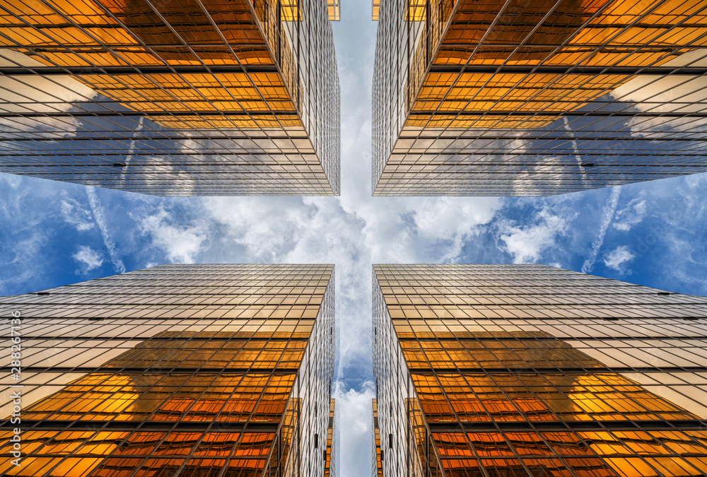 Uprisen angle of Hong Kong skyscraper with reflection of clouds among high building, Building glasses, business and financial, Architecture and industrial concept