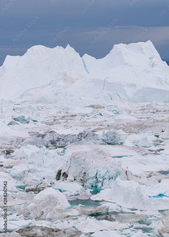 Arctic icebergs in Greenland, drone view. Global warming concept.