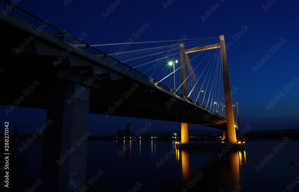 Bridge over  Columbia river at night with reflections