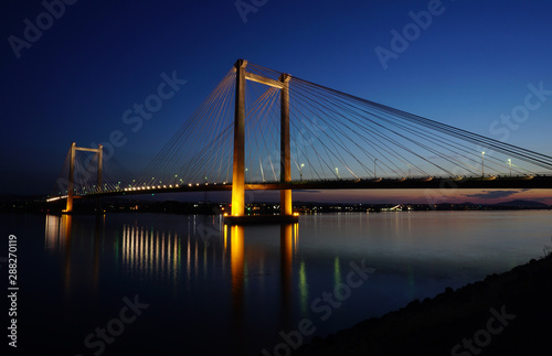 Bridge over Columbia river at night with reflections