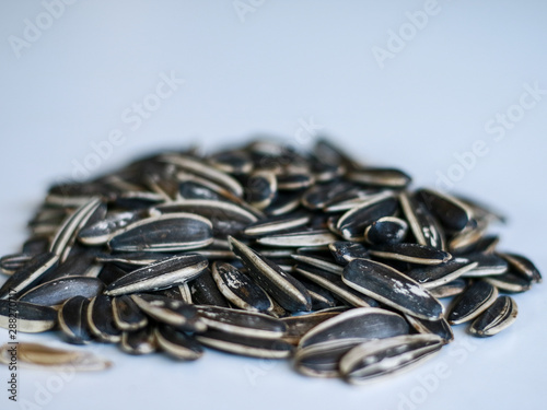 Sunflower seed snack or kuaci on white background. photo