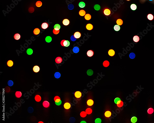 multi coloured bokeh lights on black background