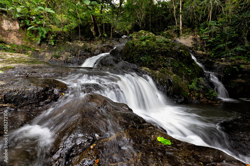 Fototapeta Naklejka Na Ścianę i Meble -  Background Beautiful waterfall in mountains. Traveling along mountains and rain forest. Chet Khot Nature and Ecotourism Center, Saraburi, Asia, Thailand