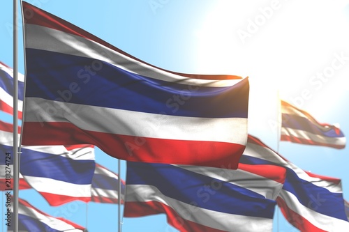 pretty anthem day flag 3d illustration. - many Thailand flags are waving against blue sky photo with bokeh