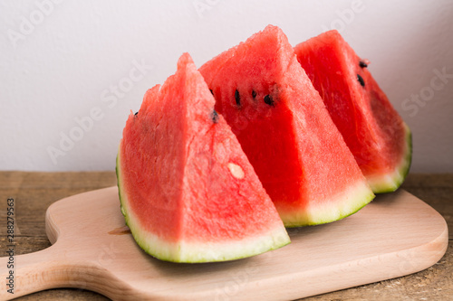 Slices of watermelon on wooden table, Closeup