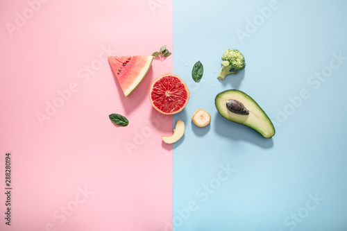 Fototapeta Naklejka Na Ścianę i Meble -  Different fruits and vegetables on a colored background.