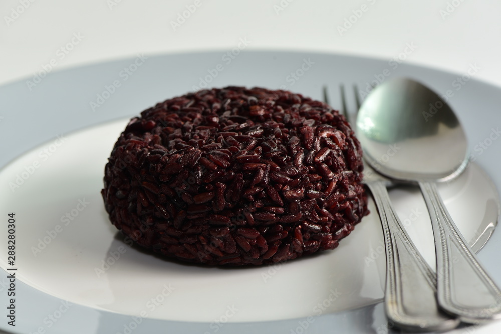 Cooked rice berry in plate on white background Cooked rice berry in plate on white background