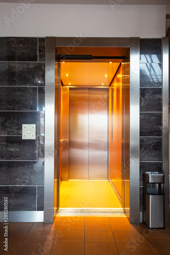 Fototapeta Naklejka Na Ścianę i Meble -  Building Elevator with open door in apartment complex luxury