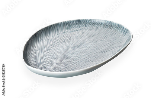 Oval ceramic plate, Empty white plate with stripe pattern, isolated on white background with clipping path, Side view 