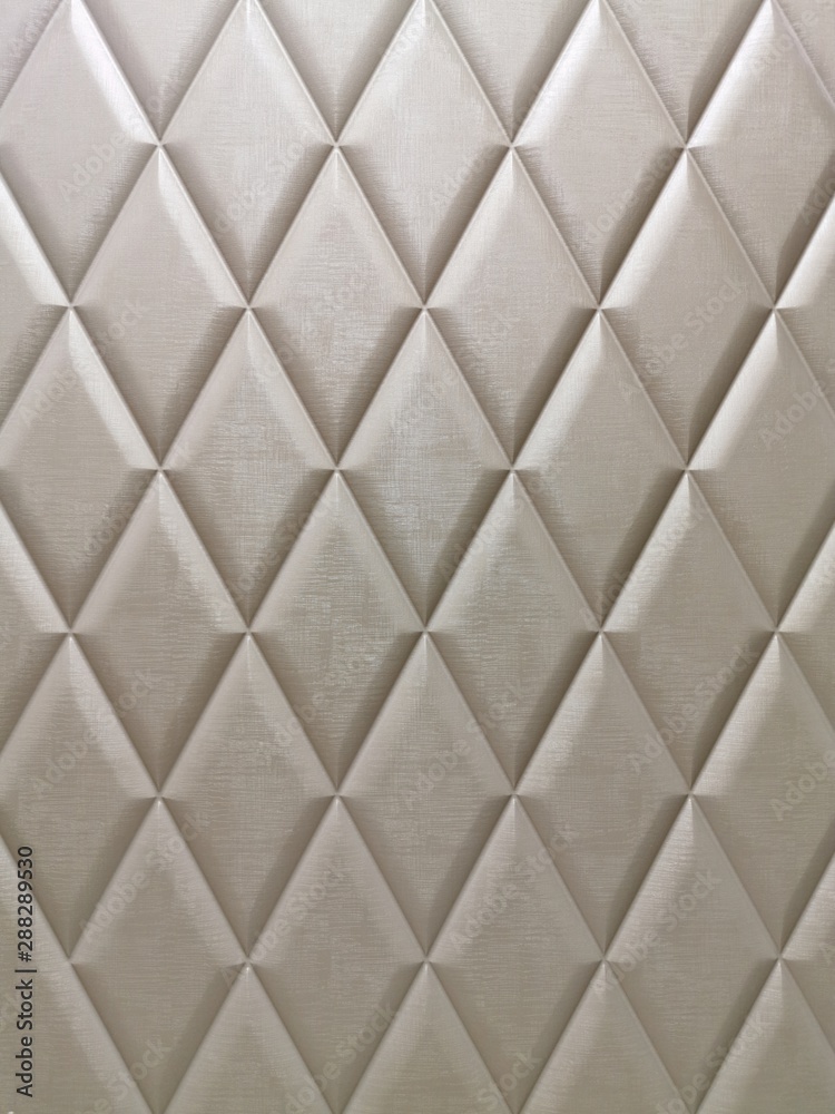 Fototapeta premium Texture in the form of rhombus - decorative volume convex embossed texture in light Golden beige tones.