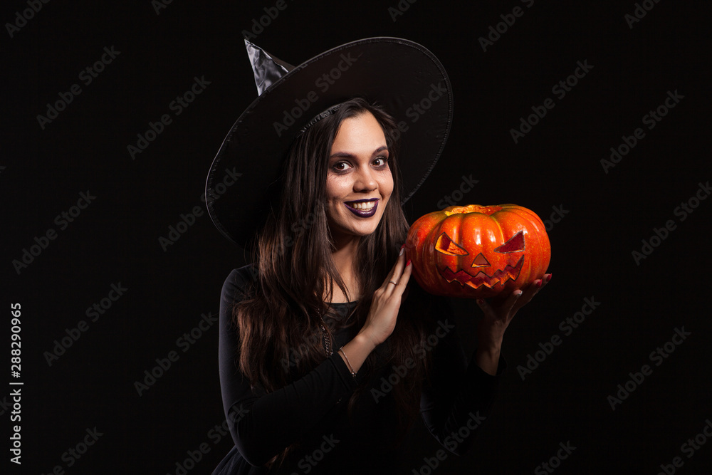 Beautiful caucasian woman in a witch costume for halloween party Beautiful caucasian woman in a witch costume for halloween party