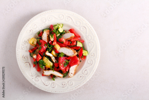 Salad with chicken fillet slices