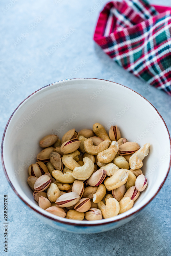 Cashew and Siirt Pistachios in Ceramic Bowl. Healthy Organic Snacks. Cashew and Siirt Pistachios in Ceramic Bowl. Healthy Organic Snacks.