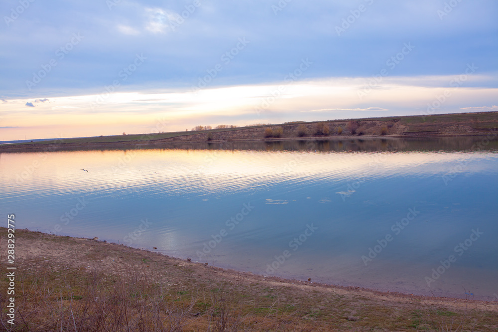 scenery with calm lake in the evening