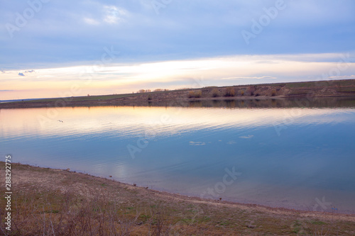 Fototapeta Naklejka Na Ścianę i Meble -  scenery with calm lake in the evening