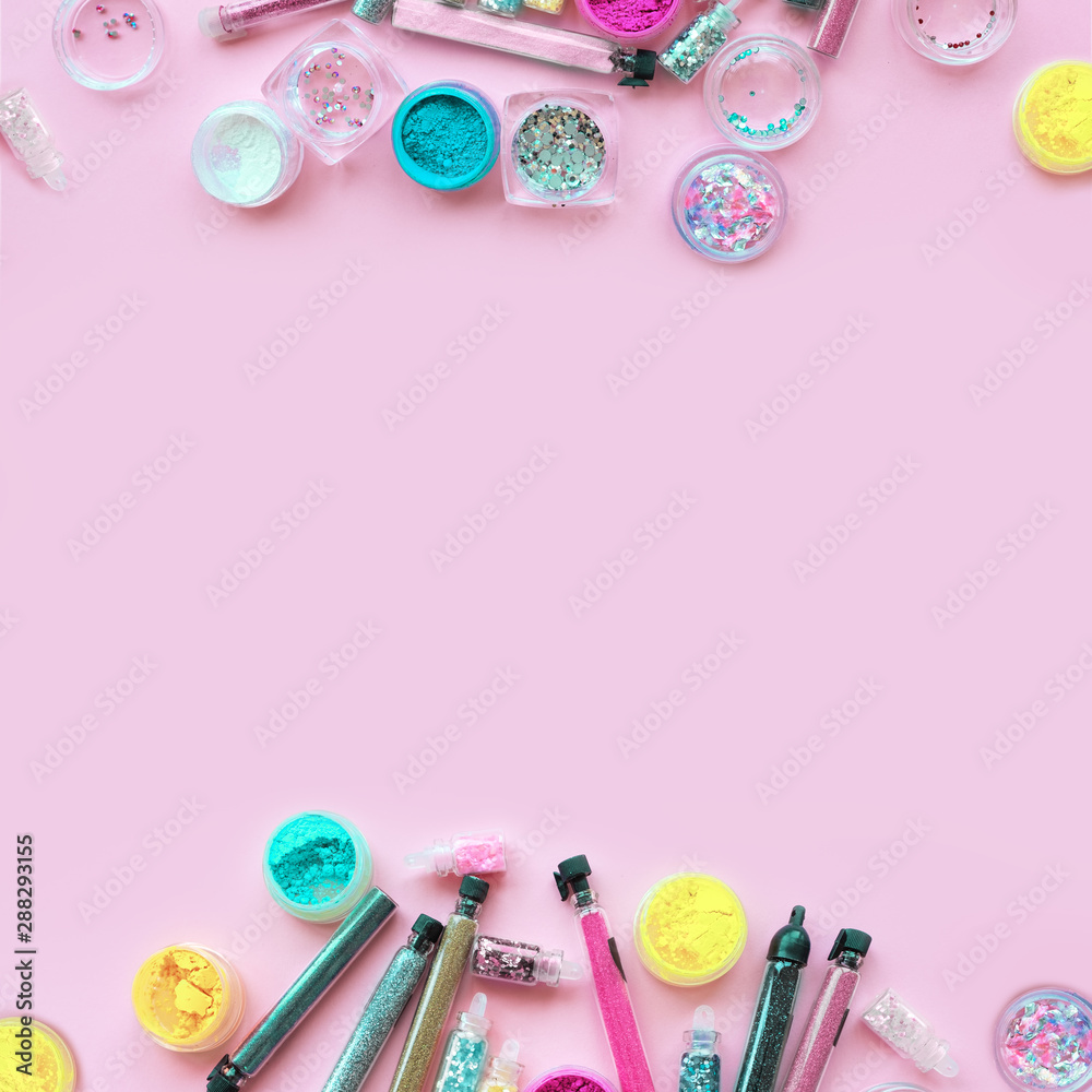 Sparkles in jars on a pink pastel background.