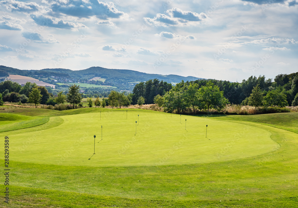 Fototapeta premium green golf course in sunlight, Germany.