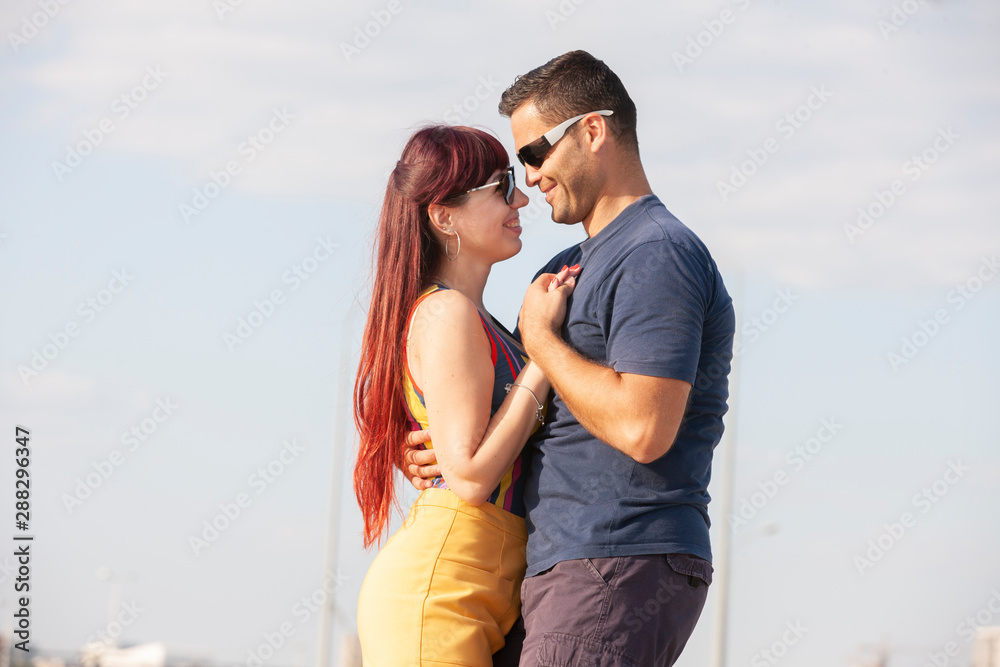 Young couple dancing Latino dance against urban landscape. Young couple dancing Latino dance against urban landscape.