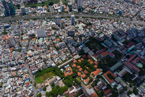 Landscape Ho Chi Minh city take by drone on the sunset with building , downtown street and public transport - at Viet Nam