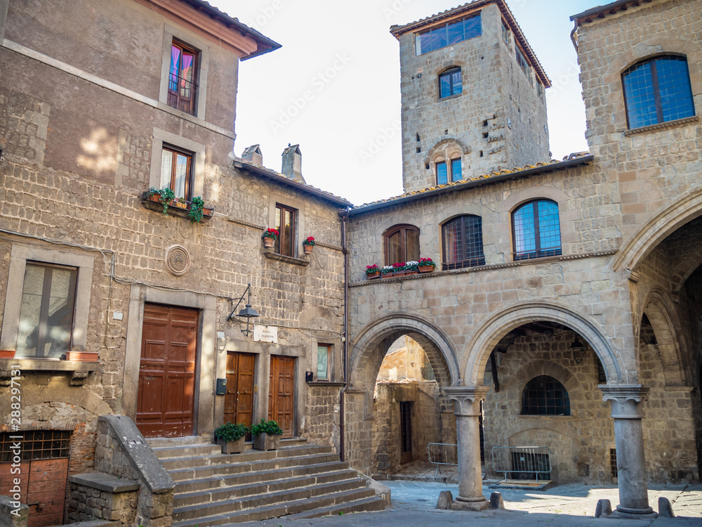 old stone houses in narrow streets in the old town of Viterbo, Italy