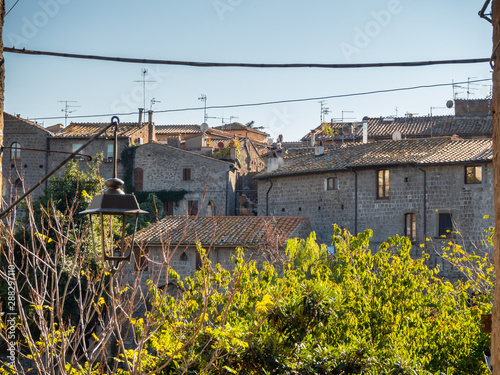 old stone houses in narrow streets in the old town of Viterbo, Italy © Alex