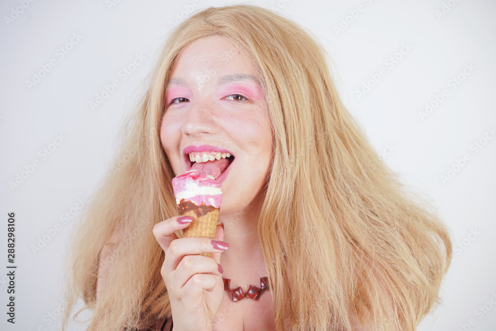 Girl eating ice cream and looking cute on white studio background. happy excited expression portrait of Multicultural Asian young woman model. Girl eating ice cream and looking cute on white studio background. happy excited expression portrait of Multicultural Asian young woman model.