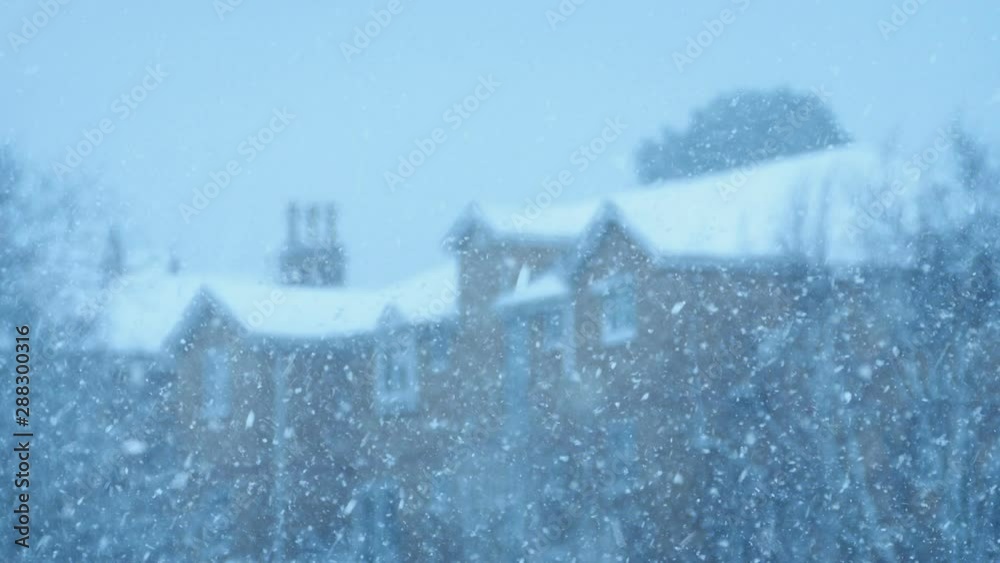 Snow Flakes Falling With Out Of Focus Building Behind Snow Flakes Falling With Out Of Focus Building Behind