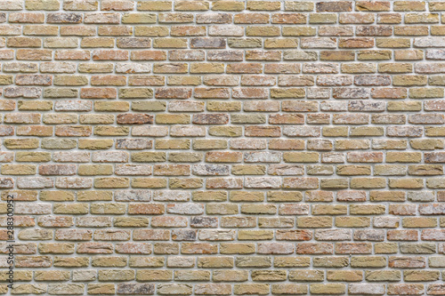Vintage style yellow brick wall. Brick background