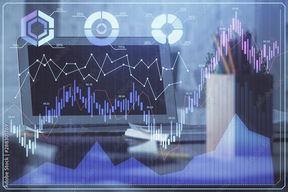 Financial graph colorful drawing and table with computer on background. Double exposure. Concept of international markets. Financial graph colorful drawing and table with computer on background. Double exposure. Concept of international markets.